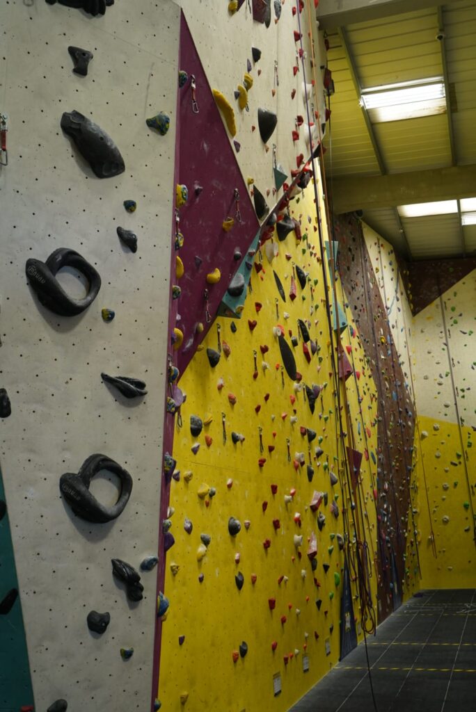 A photo of an overhang along with flatter climbs and 2 auto-belays at Dublin Climbing Centre