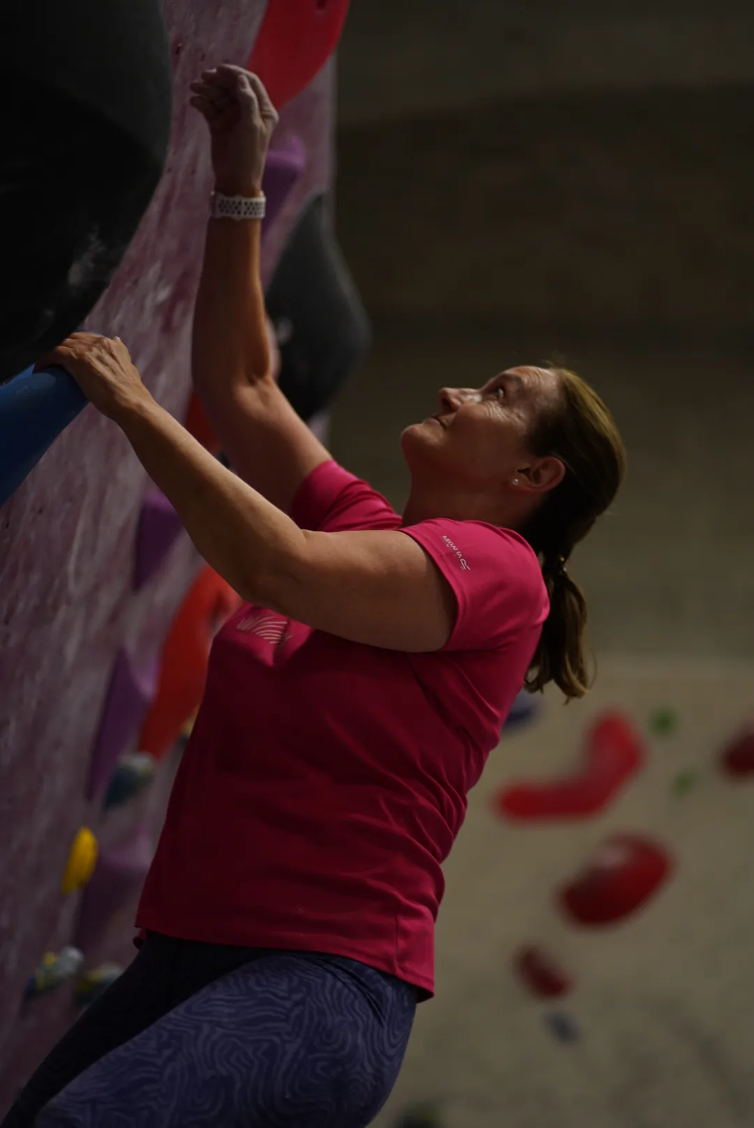 A woman bouldering during a Thursday's Women's Coaching session at Dublin Climbing Centre