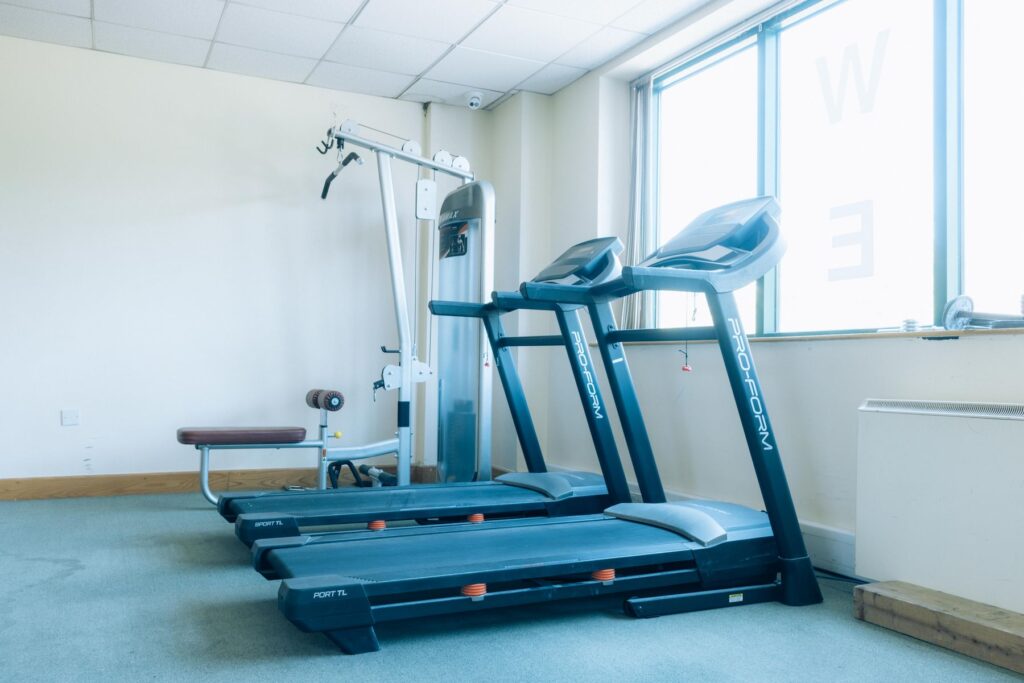 Two treadmills beside a cable weight machine at Dublin Climbing Centre